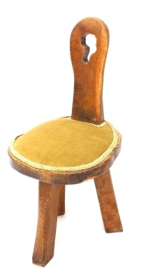 A rustic oak child's or hall chair, with later padded seat, 67cm high.