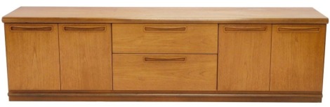 A teak low side cabinet, with an arrangement of two drawers and four doors, 54cm high, 201cm wide.