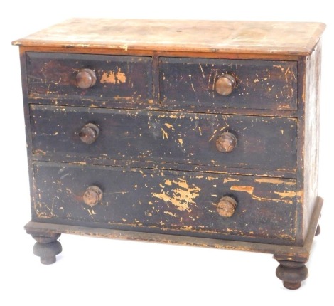 A Victorian painted pine chest of drawers, top with a moulded edge above two short and two long drawers, on bun feet, 77cm high, 93cm wide.