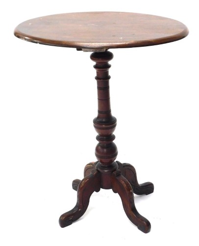 A Victorian walnut occasional table, the oval top with a moulded edge, on a turned column and four splayed legs, 54cm wide.