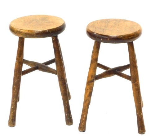 A pair of turned beech workshop stools, 46cm high.