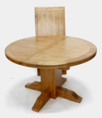 A light oak extending dining table, the rectangular top with rounded ends, on a central column with X shaped base, 77cm high, 175cm wide, 125cm deep, and six matching chairs, each with a shaped back inset with cream and leather padding, the matching padde - 2