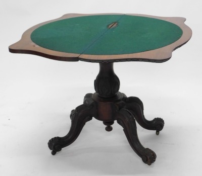 A Victorian figured mahogany card table, the serpentine shaped top with a carved edge, on a baluster shaped carved column and four splayed legs, 89cm wide. - 2