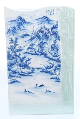 A 20thC Chinese blue and white and celadon porcelain stick stand, of rectangular section, with a wavy top and twin division interior, decorated with a river landscape, and moulded with a partial frame of leaves and lillies, signed, 43cm high, 26cm wide. - 2