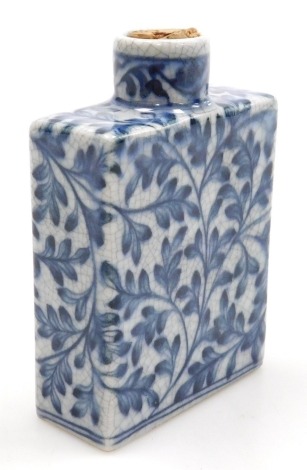 A Qing dynasty crackle glaze blue and white snuff bottle, of rectangular section, decorated with a scrolling leaf design, 8.5cm high.