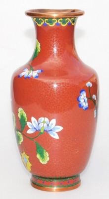 A Chinese iron red ground cloisonne enamel vase, of baluster form, decorated with blue flowers within a ground of gilt stars, 20.5cm high, and similar bowl, 16cm wide. (2) - 3