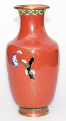 A Chinese iron red ground cloisonne enamel vase, of baluster form, decorated with blue flowers within a ground of gilt stars, 20.5cm high, and similar bowl, 16cm wide. (2) - 4