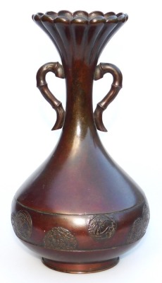 A Meiji period bronze vase, of fluted, and twin handled, baluster form, the body with a band embossed with prunus blossom and floral roundels, three character signature to base, 24.5cm high. - 3