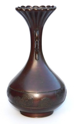 A Meiji period bronze vase, of fluted, and twin handled, baluster form, the body with a band embossed with prunus blossom and floral roundels, three character signature to base, 24.5cm high. - 4