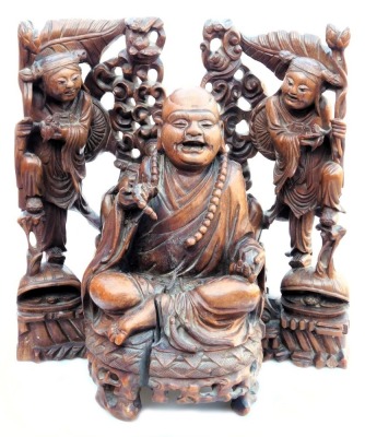 A late 19thC Chinese hardwood carving of a Buddha, seated on a lotus flower, 33cm high, and a pair of carvings of two women bat catchers, one seated, the other standing upon a shell, within a surround of bats and clouds, 38cm high. (3, AF)