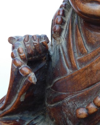 A late 19thC Chinese hardwood carving of a Buddha, seated on a lotus flower, 33cm high, and a pair of carvings of two women bat catchers, one seated, the other standing upon a shell, within a surround of bats and clouds, 38cm high. (3, AF) - 8