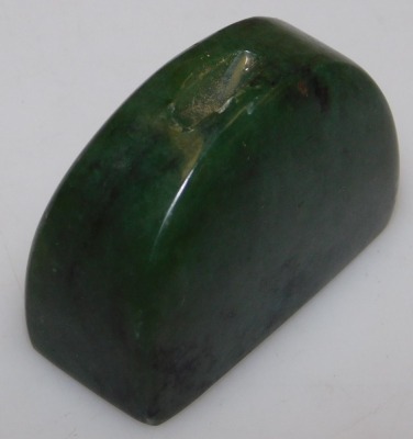 A jadeite pendant carved as the Happy Buddha, 5.5cm high, and a spinach jade carving, possibly a brush rest. (2) - 4