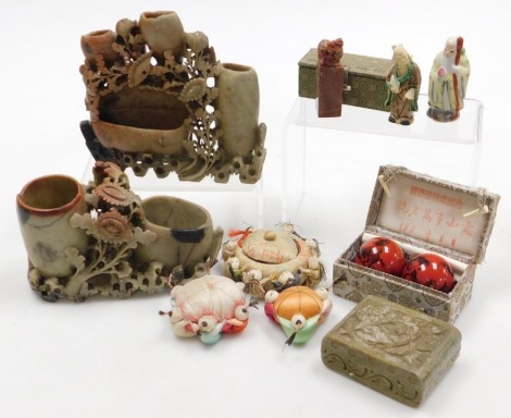 A group of Chinese collectables, including two soapstone double brush washers with floral carving, figural pin cushions, soapstone seal, and two meditation balls.