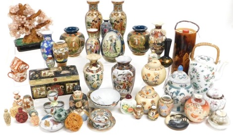 A group of Chinese and Japanese pottery and porcelain, including a pair of Satsuma vases, seated Satsuma figure, ginger jars and covers, resin snuff bottles, puzzle balls, etc. (a quantity)