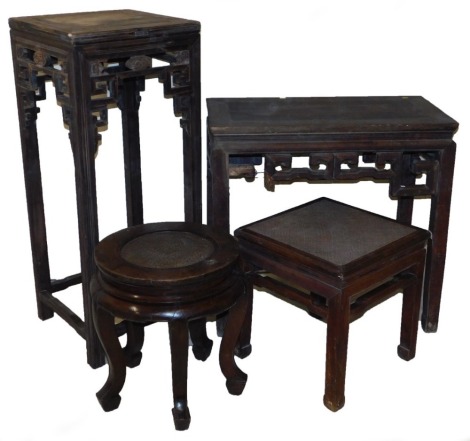 A Chinese hardwood and rattan stool, 52cm high, 48cm wide, 48cm deep, a square stand, 120cm high, 49cm wide, 49cm deep, circular rattan topped urn stand raised on five cabriole legs, 54cm high, and a hardwood side table, raised on square legs, 85cm high, 