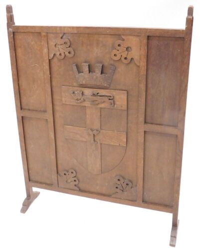 An oak fire screen, decorated with a crest and initials R, 69cm wide, and a pine box. (2)