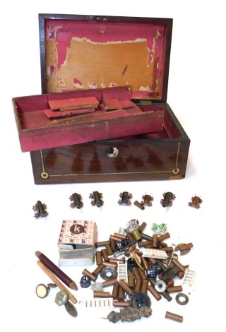 A Victorian rosewood and mother of pearl inlaid workbox, containing a toy train, cannons, Victorian silver brooch "Polly", bullet cases, etc., 22.5cm wide.