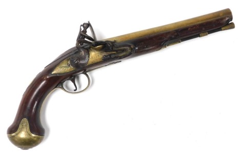 A late 18thC flintlock pistol by Grice of London, with a walnut stock and brass barrel, trigger guard and butt-stop, 33cm wide.