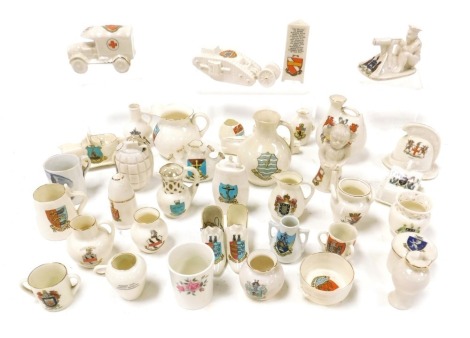 Goss and crested china, Carltonware ambulance, arms of Ripon, fireman's helmet, arms of London, Arcadian model of Tommy and His Machine Gun, arms of Leeds, model of a tank, arms of Grantham, and a Goss model of a Worcester jug, arms of Ilfracombe. (a qua