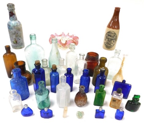 Victorian and later glass bottles, including poison bottles, Catley Abbey Natural Seltzer bottle, F Fletcher Limited of Grantham bottle and T T Houghton of Billingborough bottle, corked, together with an Apollo stone ginger beer bottle and a glass bowl. 