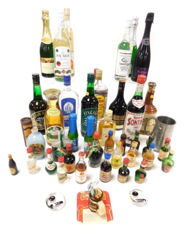 Wine and spirits, including a Bells Old Scotch Whisky decanter, with contents, gin, Tia Maria, Bacardi, miniature bottles, etc. (a quantity)