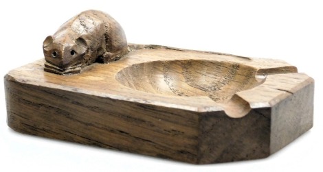 A Robert Mouseman Thompson of Kilburn carved oak ashtray, the mouse with a curved tail, 10cm wide.