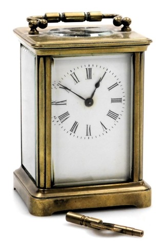 A brass cased carriage clock, rectangular enamel dial bearing Roman numerals, single barrel movement, the case of conventional form, with key, 12cm high.