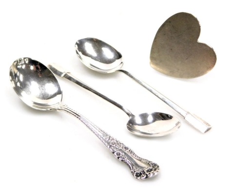 An American silver teaspoon, Edward VII silver heart shaped place card holder, Chester 1908, and a pair of George V silver coffee spoons, Birmingham 1931, 1.55oz.