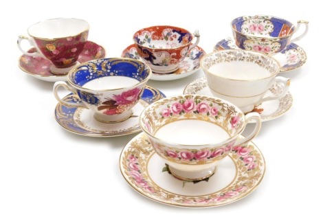 Six late 19thC and later tea cups and saucers, including Coalport, Old Country Roses Ruby Lace, and a cup and saucer printed with grapes and nuts.