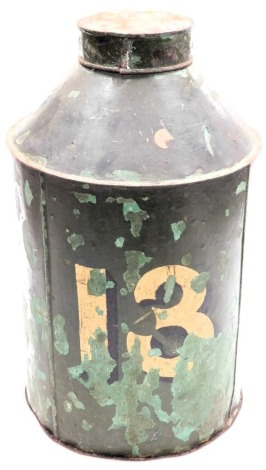 A Victorian tole ware tea canister, numbered thirteen, against a green ground, 14cm high.