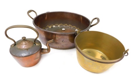 A Victorian copper twin handled jam pan, 60cm wide, a brass preserving pan with cast iron handle, 29cm wide, and a copper kettle. (3)