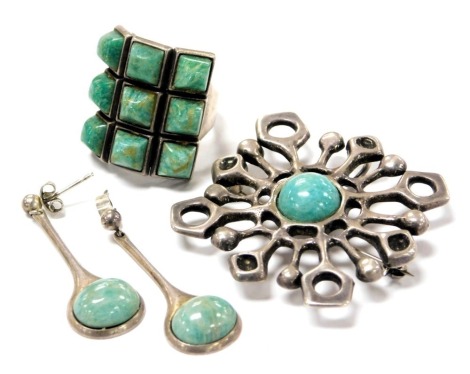 A group of David Andersen silver jewellery, comprising a ring set with nine pyramidical turquoises, size O, silver and turquoise enamel brooch, and a pair of silver and turquoise enamel drop earrings. (3)