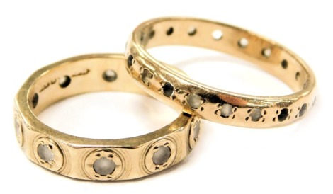 A 9ct gold and gem set eternity ring, size N/M, and a further full eternity ring, size I, 5.2g.