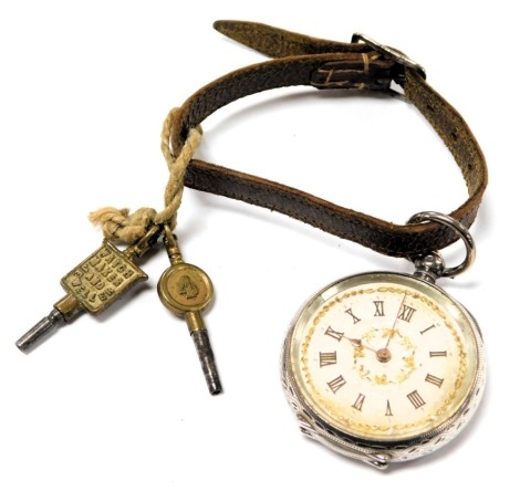 A lady's silver cased pocket watch, open faced, key wind, silvered dial with chapter ring bearing gilt Roman numerals, the case with floral and foliate engraving, vacant shield reserve, on a leather strap with two watch keys.