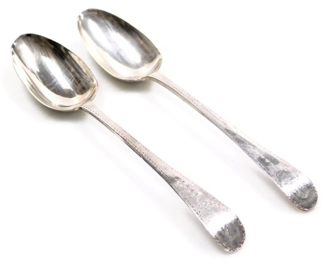 A pair of George III silver table spoons, with bright cut engraving, oval reserve monogram engraved, Stephen Adams II, London 1783, 4.06oz.