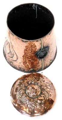 An Arts and Crafts copper lidded coal bin, of cylindrical tapering form with hammered decoration and foliate motif, with wrought iron ring handles, 44cm high. - 2