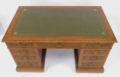 A Victorian carved oak twin pedestal desk, with leather top and carved mask head handles, 180cm x 82cm. - 2