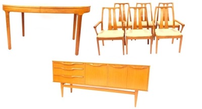 A Nathan teak dining suite, comprising extending dining table, with oval top on square legs, 76cm high, the top 152cm x 99cm, together with a set of six chairs (4+2), each with a slatted back, overstuffed seats, together with sideboard, the rectangular t