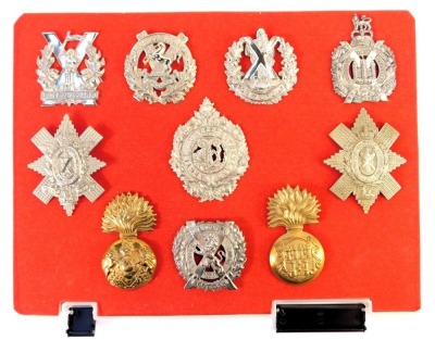 A group of military cap badges, to include Tyneside Scottish, Black Watch, Argyll and Sutherland Highlanders, Royal Dublin Fusiliers, Royal Scots Fusiliers, etc. (10)