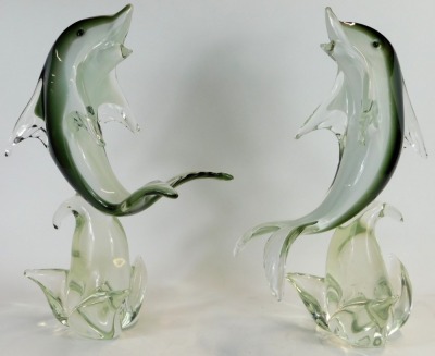 A pair of Murano glass dolphins, each on a grey, black and white ground, riding a wave, 38cm high. - 2