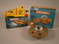 A battery operated Thunderbird 5 toy boxed and a Thunderbird 4