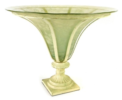 An Art Deco centrepiece, with an inverted trumpet frosted glass vase, within a cream painted frame, on a stepped pedestal base, 33cm high, 40cm diameter.