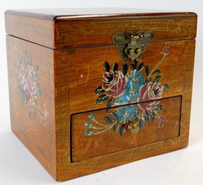 A 20thC Continental walnut jewellery casket, with boxwood inlay and painted decoration of pink and white flowers, with a mirrored and sectional top above single drawer, with brass lock plate, 18cm high, 20cm wide, 18cm deep.