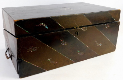 A late 19th/early 20thC Oriental lacquered writing box, on a brown ground inlaid with mother of pearl and over painted with scene of bridge and flowers, opening to reveal a blue lined writing slop interior with inkwells, 20cm high, 47cm wide, 27cm deep. (