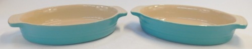 Two Le Creuset pale blue ovenware dishes, comprising 13-20 and 15-31, 29cm wide. (2)