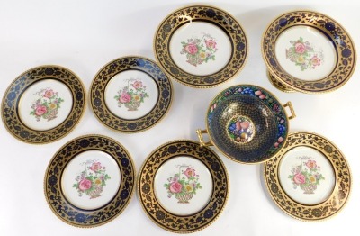 A late 19thC Booths china part service, comprising five dinner plates and two centrepiece bowls, each with a dark blue and gilded border with transfer printed floral decorated to centre, and a Minton Rotique pattern fruits and flowers bowl, on a blue and - 2