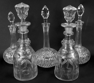 Five pressed and moulded glass decanters, comprising three squat decanters and two bottle decanters. (5)