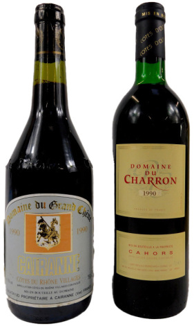 A bottle of Domaine du Grand Chene 1990 Cairanne wine, together with a bottle of Domaine du Charron 1990 wine.