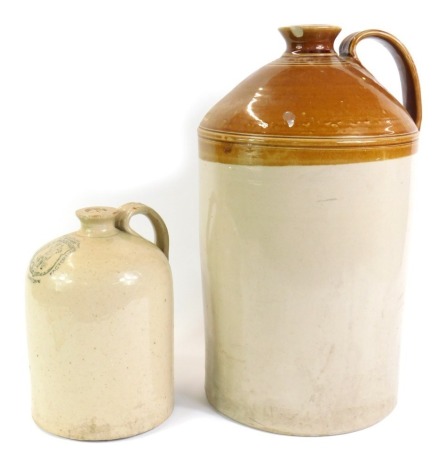 Two stoneware flagons, comprising a 19thC eight gallon flagon of two tone colouring, and a smaller example marked 11 Oxford Street London, Birmingham Micrope Killer Factory number 12, 26cm high. (2)