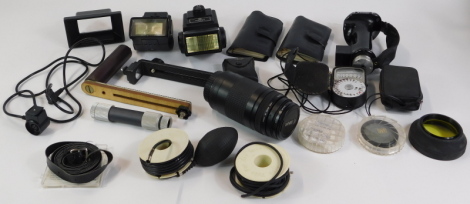 A group of camera and optics equipment, comprising Tamron camera case, Canon Zoom lens EF 75-300mm 1-4.5.6, and a Sakar 58mm lens, various flashes, cabling, supports and tripods. (1 bag)